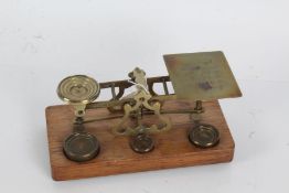 Set of postage scales with the prices of assicated weight engraved to the base, made by S.