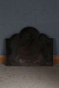 Cast iron fire back, with triple arch top, 77cm wide, 66cm high