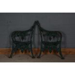 Pair of cast iron bench ends, painted in green, 83cm high