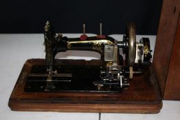 Frister & Rossman hand sewing machine, with mother of pearl inlay, housed in a walnut case