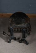Cast iron fire basket, the back plate with ribbon tied decoration, 55cm wide, together with a pair