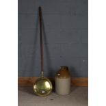 19th century long handled and brass warming pan, 134cm long, and a stoneware flagon, 40cm tall (2)