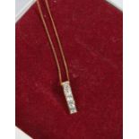 9 carat gold necklace set with a paste pendant, weight 1.3 grams housed within a jewellery box