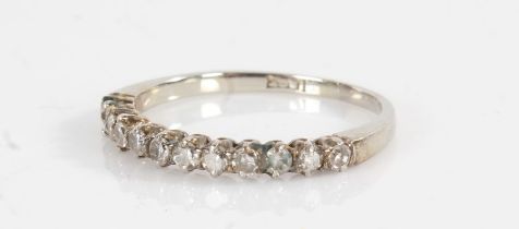 18 carat white gold half hoop eternity ring, set with twelve diamonds, ring size K1/2, 1.6g