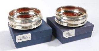 Pair of Elizabeth II silver glass coasters, London 2001, maker John Bull Ltd. with turned wooden