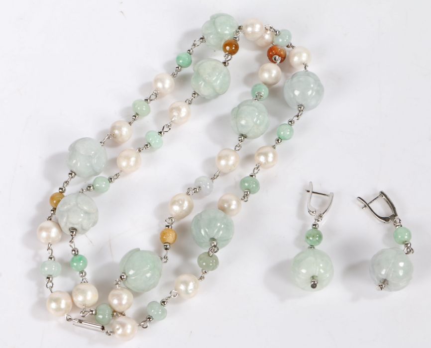 Carved jade and silver suite of jewellery, the jade interspersed by pearls together with a pair of