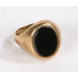 9 carat gold ring set with an oval black stone to the head, ring size W weight 7.8 grams