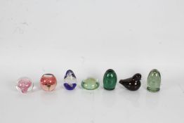 Seven glass paperweights, to include two dump style paperweights, foliate and swirled glass examples