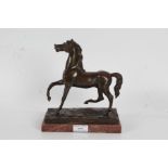 19th Century bronze horse, modelled with front and back right legs raised, on a marble plinth