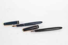 Two Parker fountain pens, one in navy and the other in black, each with 14k gold nibs (2)