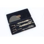 Cased set of drawing instruments, to include various compasses etc