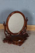 Victorian mahogany swing frame toilet mirror, the oval mirror with open scrolling supports, the
