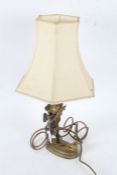 20th century gilt metal table lamp, having bronze putti column on an oval base with a bird, 33cm