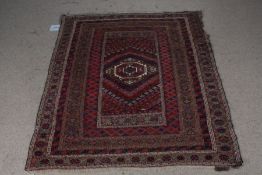 Afghan carpet, the lozenge and cross pattern central field surrounded by multiple borders and