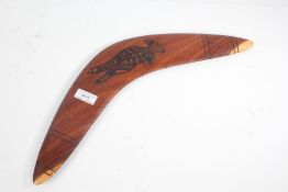 Australian boomerang, 'Koori Craft, Don Nolan', with a kangaroo to one side, 45cm