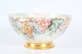 Large French porcelain bowl, probably Limoges, with hand painted grape and vine decoration, signed