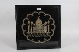 Indian embroidery depicting the Taj Mahal, housed within a glazed and ebonized frame