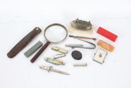 Mixed works of art, to include a magnifying glass, pen knives, miniature bayonet dated 1935, poker
