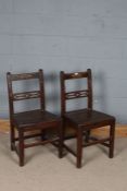 Pair 18th century country oak chairs, with pierced back rests and solid seats (2)