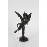 Bronze figure depicting a cherub holding a dolphin, on an octagonal domed base, 21.5cm high