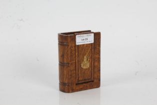 19th Century oak snuff box, of book form, the hinged lid with brass depiction of a bishop, 7.5cm