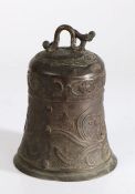 Chinese bronze bell, cast with a beast above a scrolling body and interlinked beasts, 19cm high