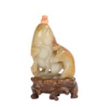 Chinese Qianlong period jade snuff bottle, (1737-1795) a brown and white jade snuff bottle with a