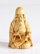 Japanese ivory netsuke, Meiji period, carved as a seated scholar, signed to the underside of the