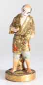 Japanese Satsuma earthenware figure, 20th Century, the standing figure with a basket in one hand,