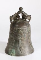 Chinese bronze bell, surmounted by a beast above an archaic style body, 23cm high