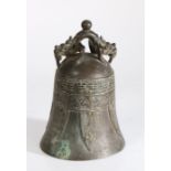 Chinese bronze bell, surmounted by a beast above an archaic style body, 23cm high