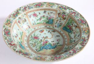 Chinese Canton porcelain punch bowl, Qing Dynasty, with a muted green ground and colourful panels