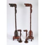 Set of four Chinese hardwood lamps, to include two standard lamps with dragon heads above a