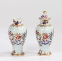 Pair of Chinese porcelain armorial vases, Qing Dynasty, the vases with a European market armorial