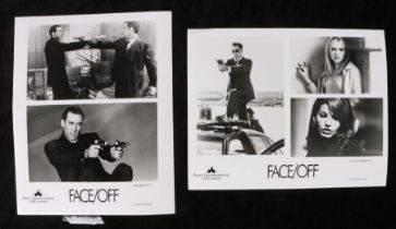 Press release photograph for the film Face Off, to include two photographs  Provenance: From a media