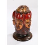 Late 19th Century string box, with an open mouthed face for the string above five carved children'
