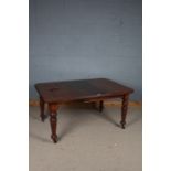 Victorian extending dining table, with chamfered corners, one extra leaf and winder, raised on tuned