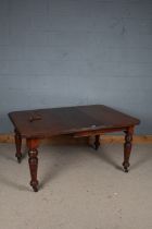 Victorian extending dining table, with chamfered corners, one extra leaf and winder, raised on tuned