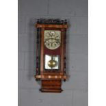 Victorian walnut Vienna wall clock, having inlaid decoration, the singe glazed enclosing a dial with