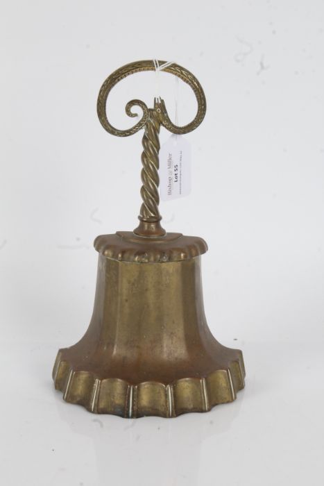 Regency brass doorstop, the twisted serpent handle above a gadrooned stem and tapering lower