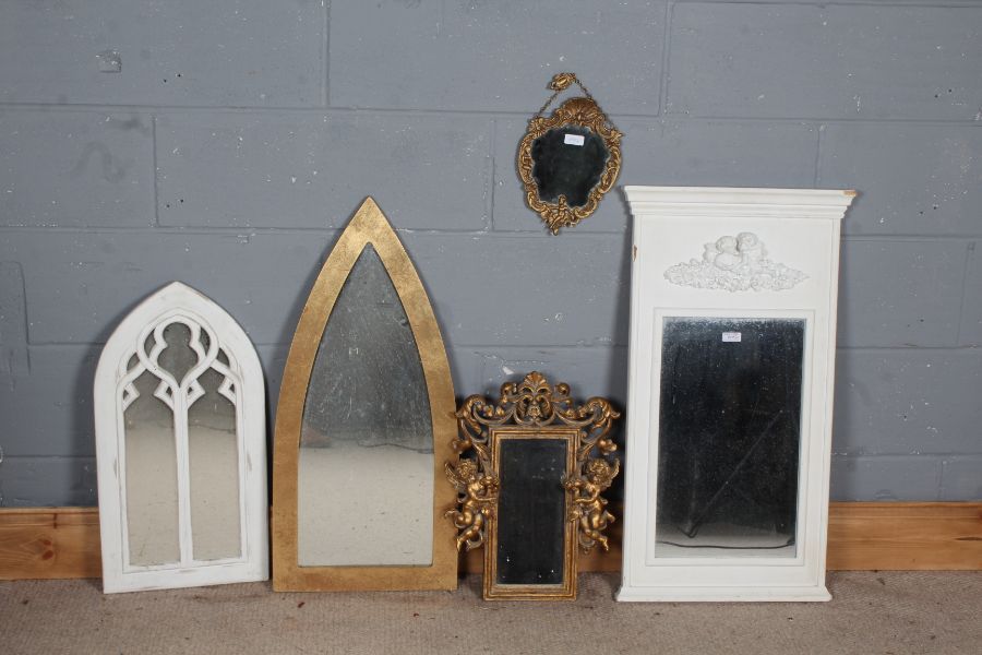 Five various mirrors, to include three with cherub decoration, and two of arched form (5)