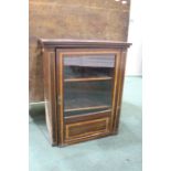 Edwardian mahogany and inlaid side cabinet, the singe glazed door enclosing two shelves (reduced),