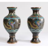 Pair of Chinese cloisonné vases, each with two dragons and a black ground, 24cm high, (2)
