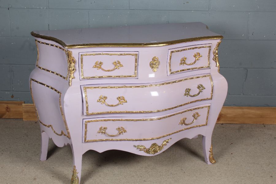 20th century French commode chest, of bombe form, in lilac, with gilt metal drawer fronts and