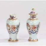 Pair of Chinese porcelain armorial vases, Qing Dynasty, the vases with a European market armorial