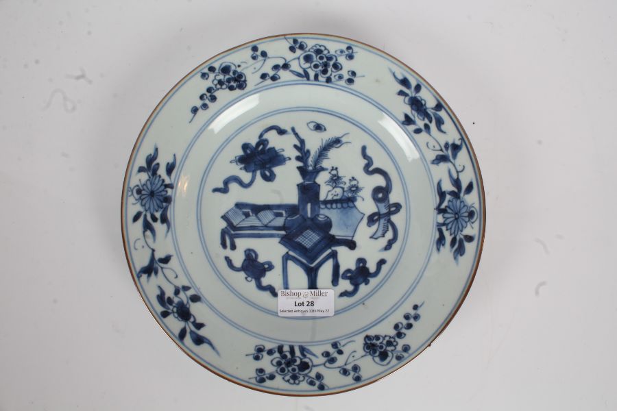 Chinese Kangxi blue and white porcelain plate, the central field with depiction of a table and