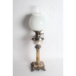 20th century silver plated and onyx oil lamp, having milk glass globular shade and chimney above a