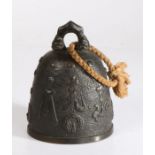 Chinese bronze bell, cast with shallow bosses and character marks, 16.5cm high