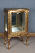 French style gilded wooden cabinet, the single glazed door enclosing a mirrored interior (lacking