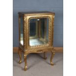 French style gilded wooden cabinet, the single glazed door enclosing a mirrored interior (lacking